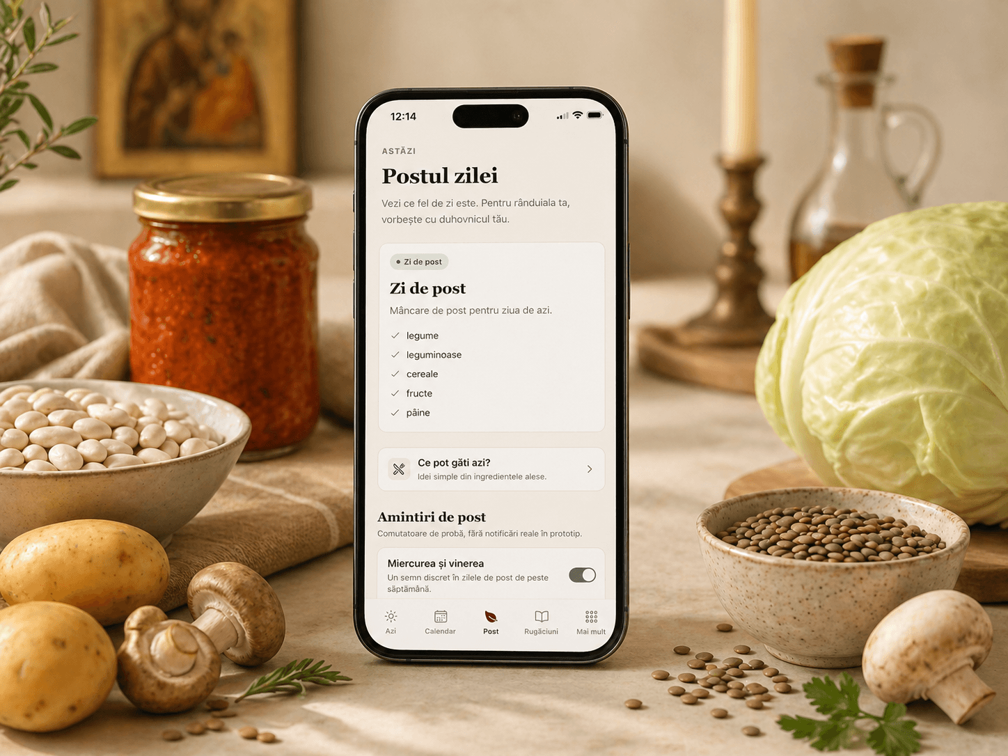 Telefon cu pagina „Postul zilei” pe o masă cu fasole, cartofi, ciuperci, zacuscă, varză și linte.
